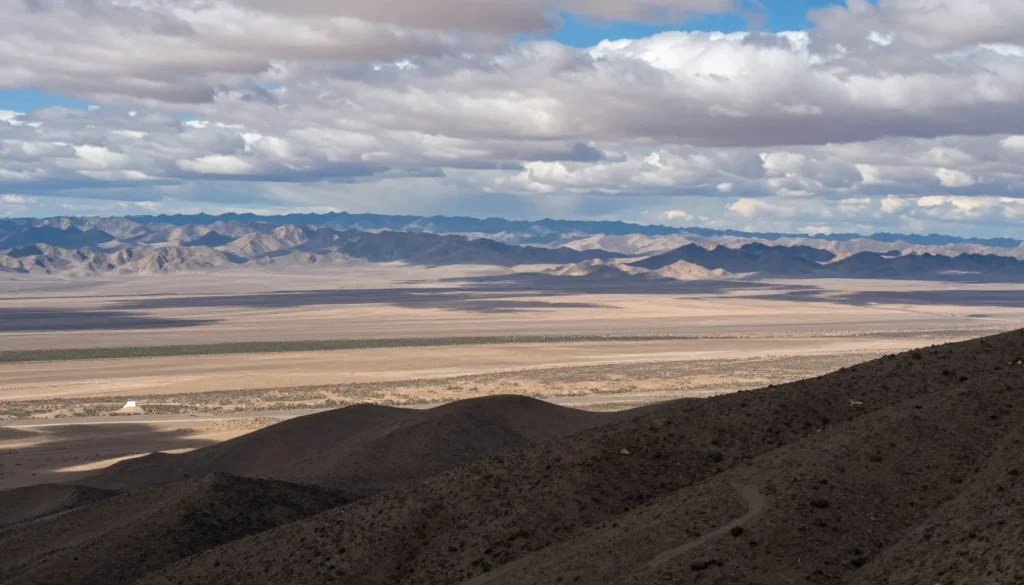 View from mountain summit showing vast desert basin below View from mountain summit showing vast desert basin below