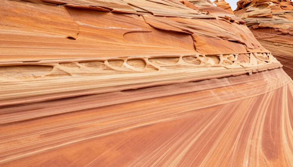 Canyon walls showing layered sandstone formations and carved patterns Canyon walls showing layered sandstone formations and carved patterns