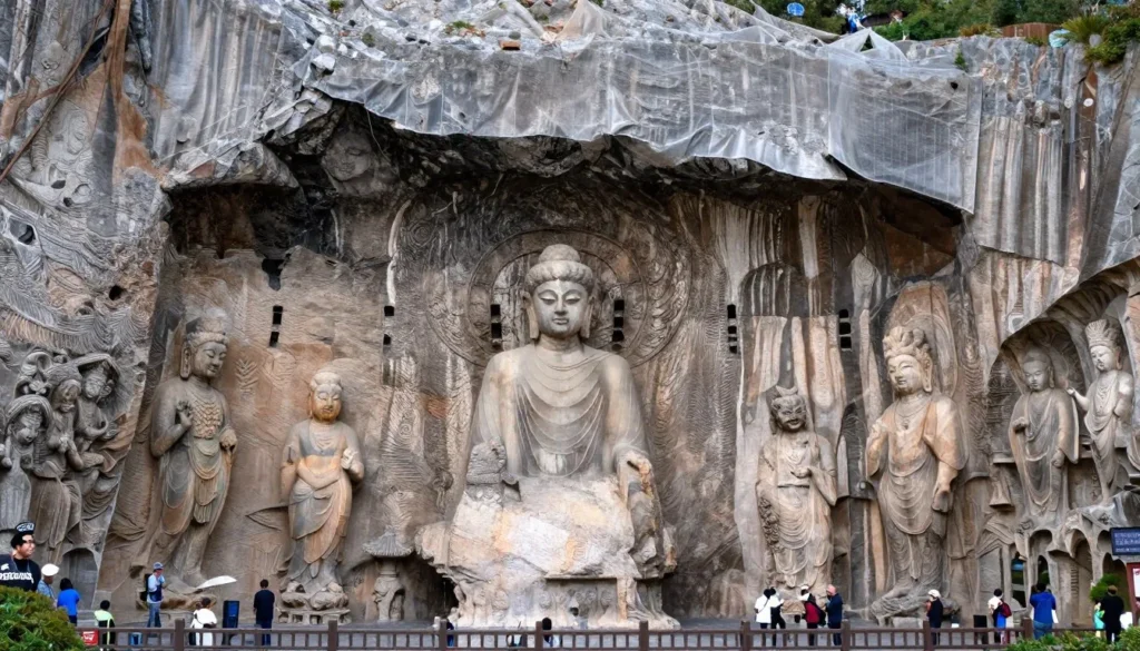 Historic Usuki Stone Buddha carvings in cliff face with visitors on wooden walkway Historic Usuki Stone Buddha carvings in cliff face with visitors on wooden walkway