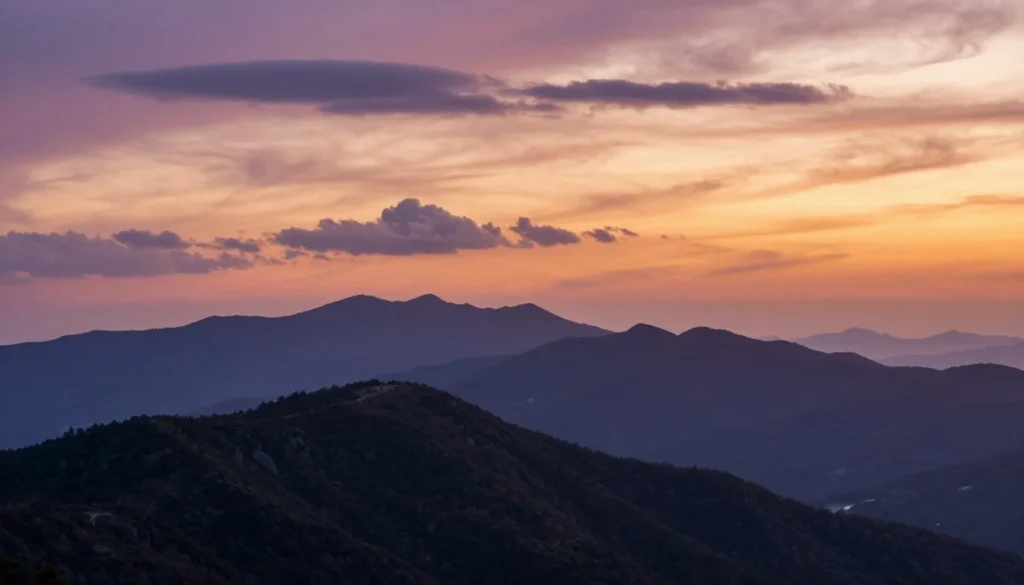 Sunset view from Grandfather Mountain summit with mountain ranges fading into distance Sunset view from Grandfather Mountain summit with mountain ranges fading into distance